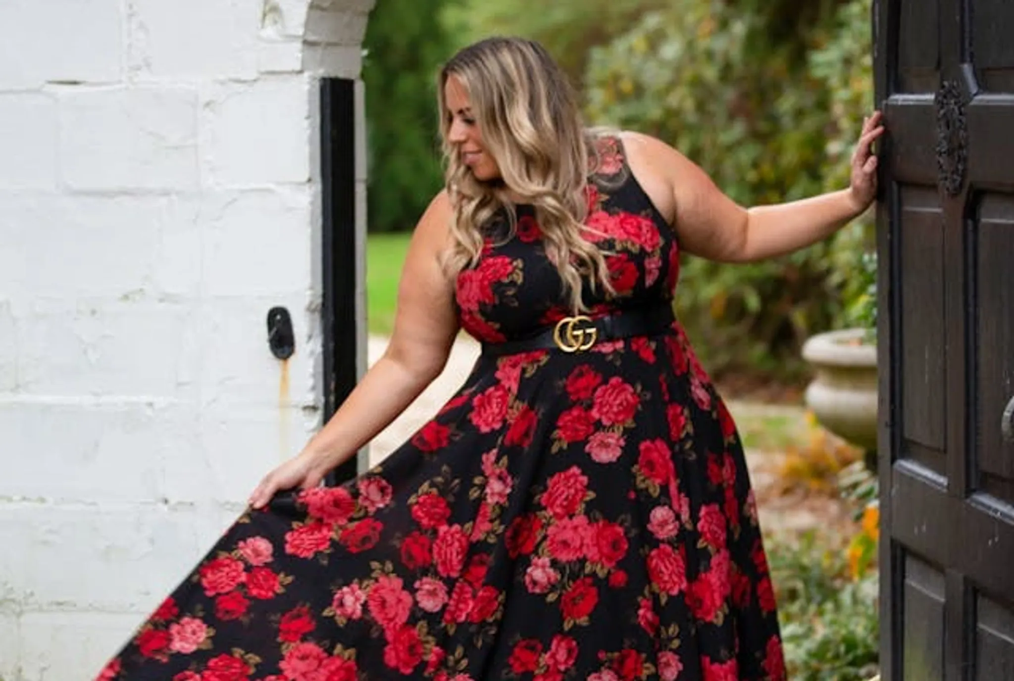 A plus-size woman with loud patterns dress