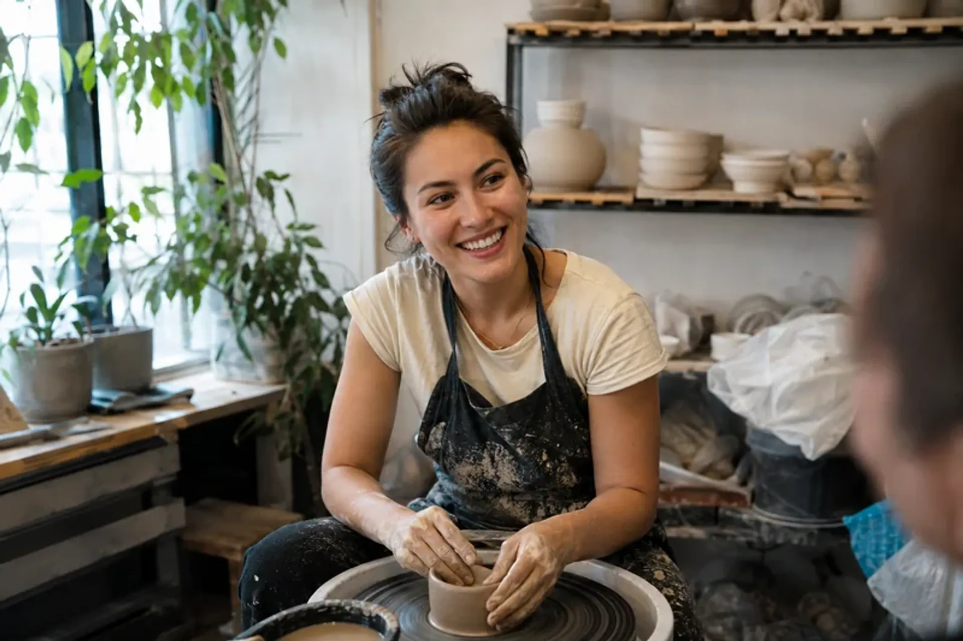 Woman making pottery in a genuine hobby candid dating profile photo