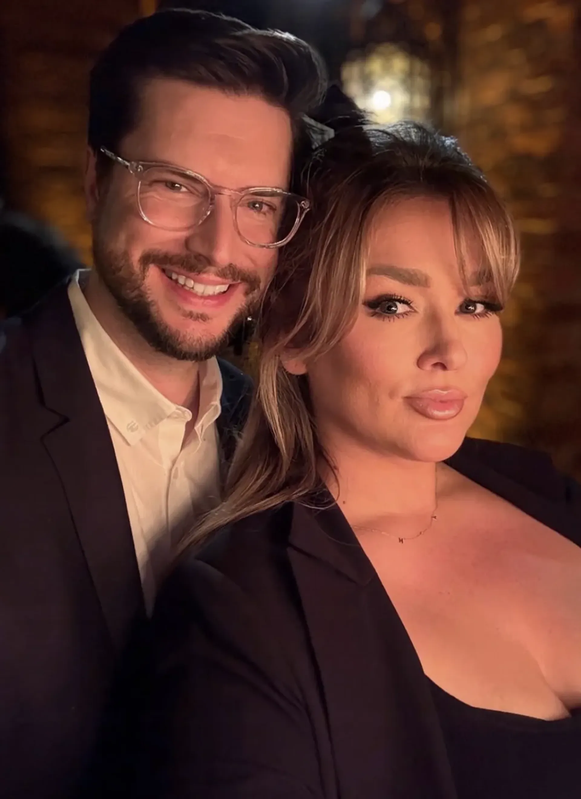 Hunter McGrady and Brian Keys posing together at an evening event