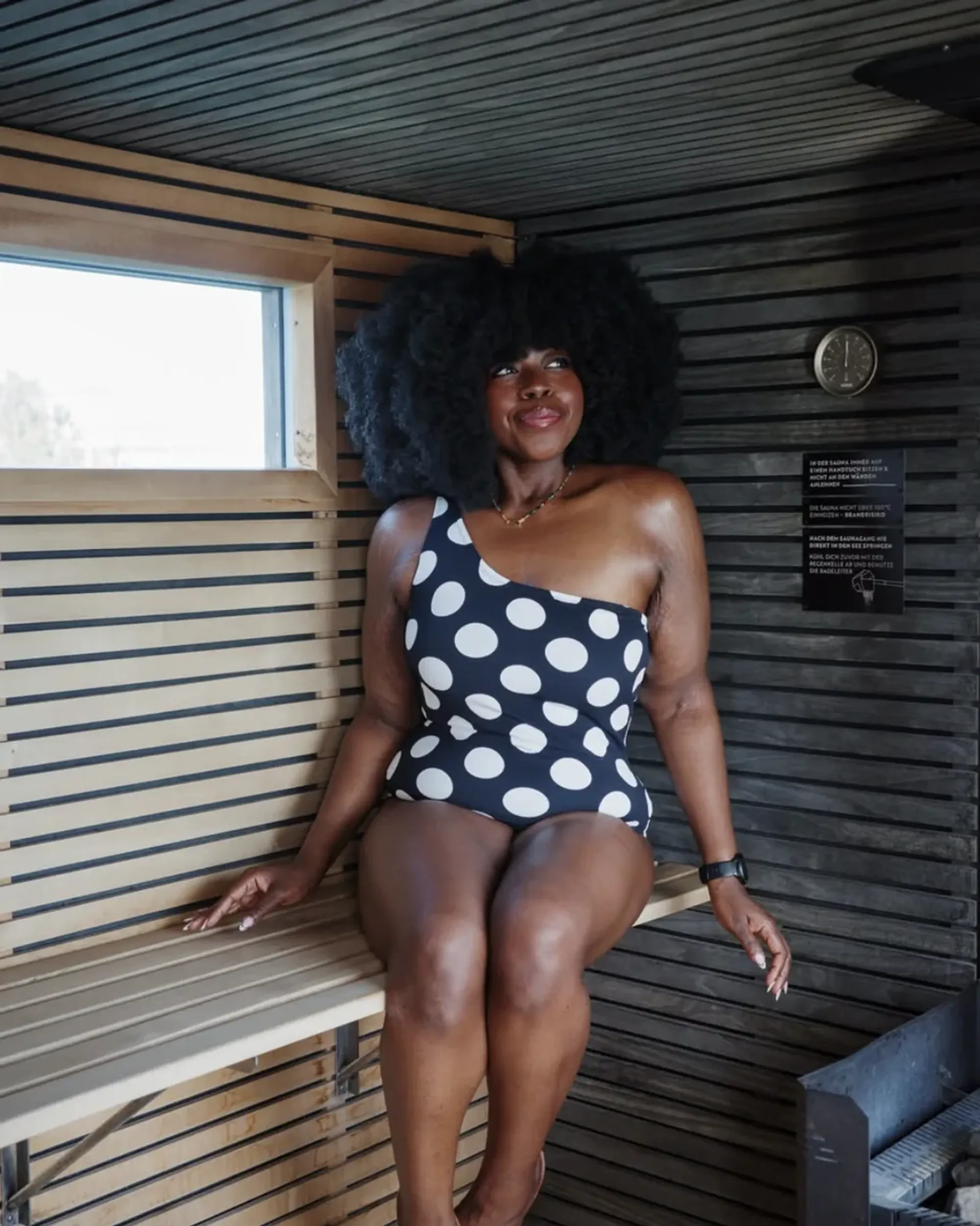 Stephanie Yeboah smiling in a black polka-dot swimsuit