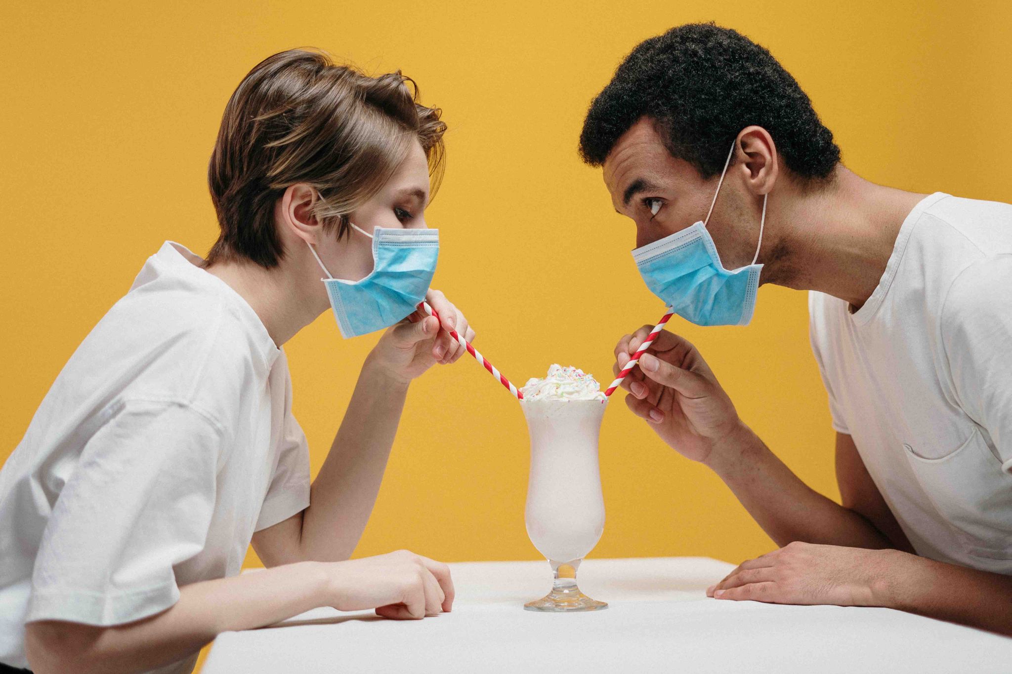 quarantine dating Couple Wearing Face Mask Drinking Milkshake