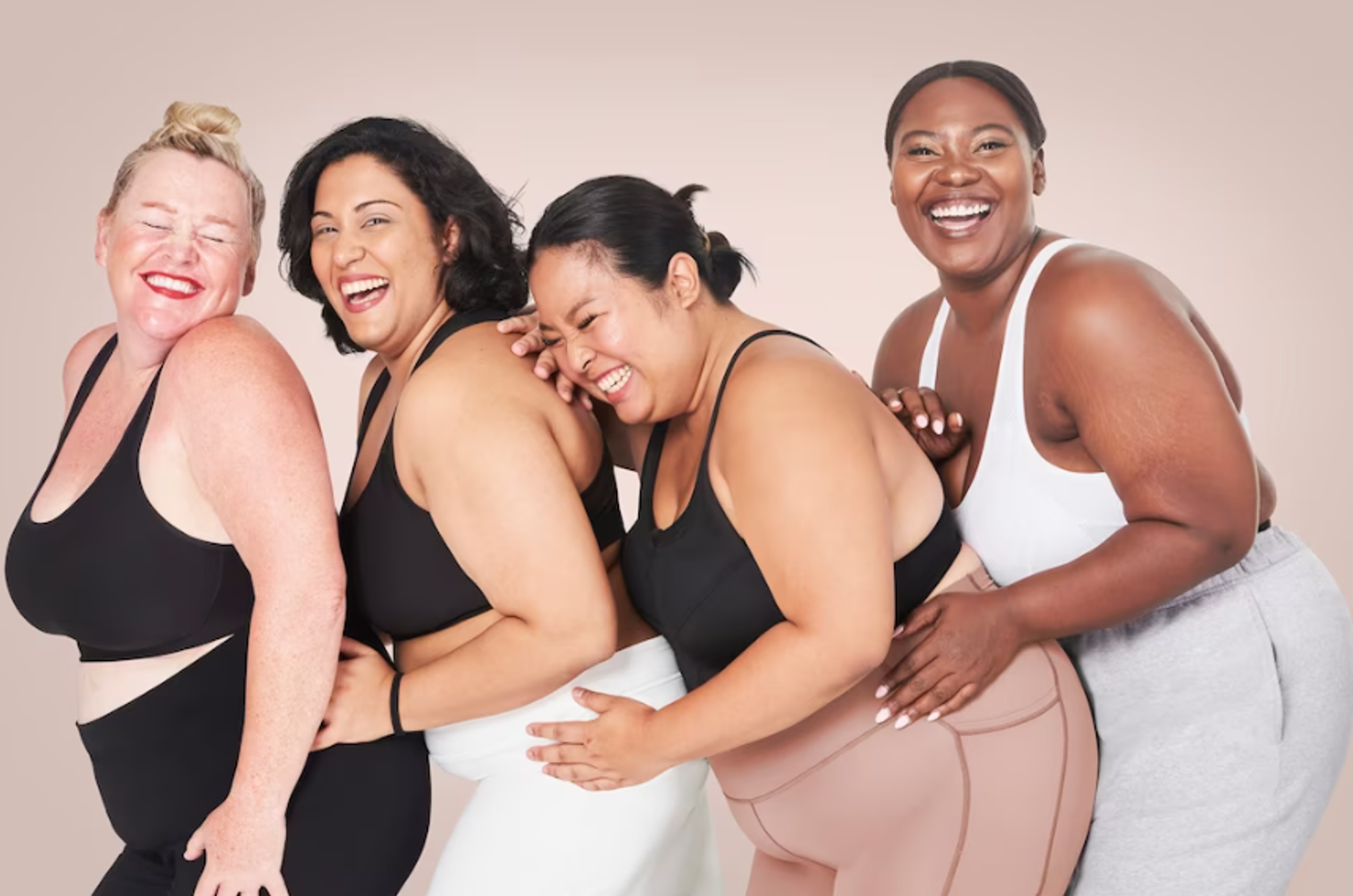Healthy curvy women smile together