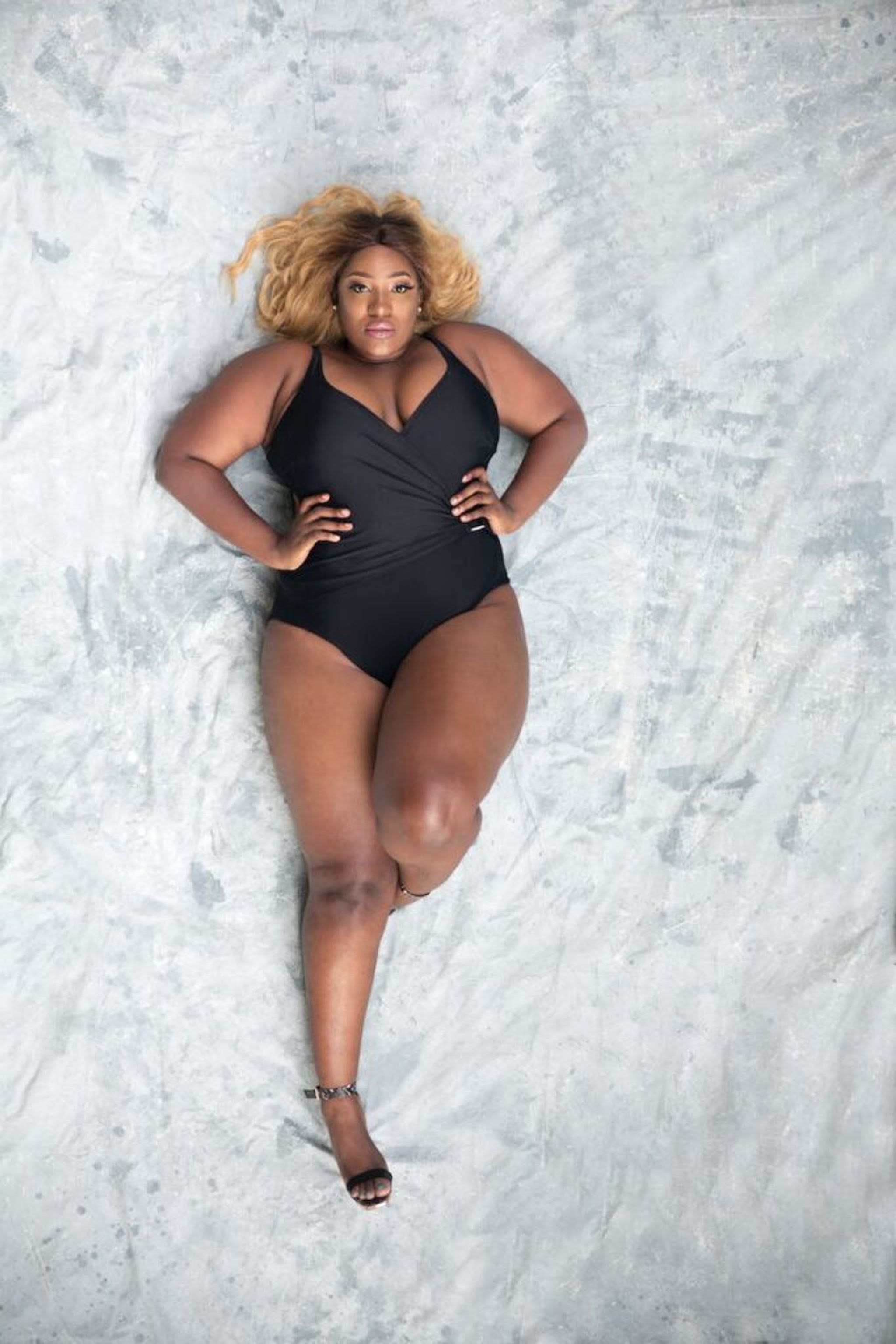 black curvy women lying on the floor