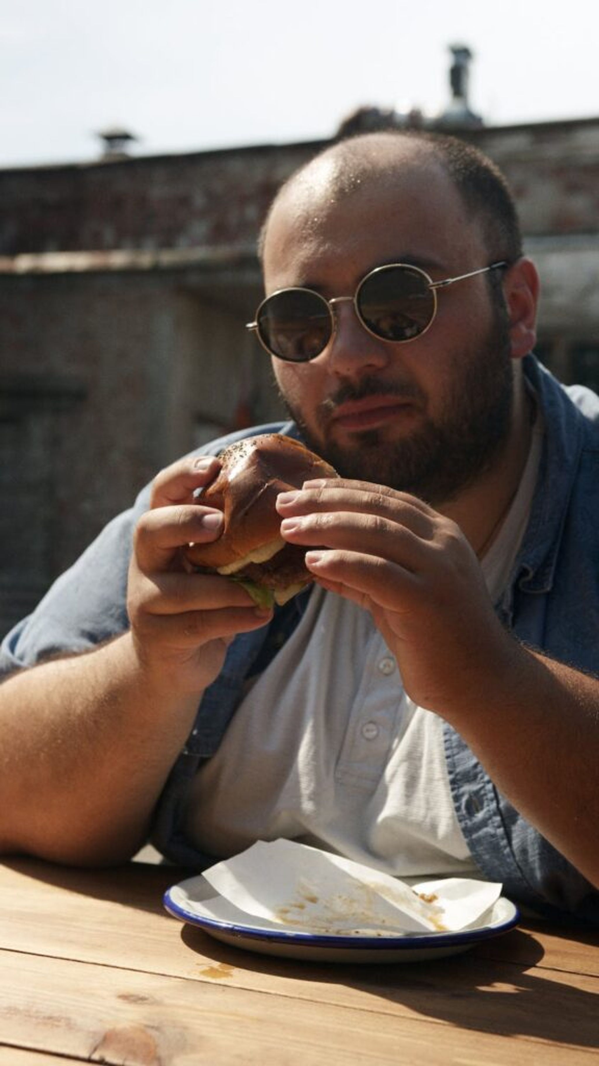 chubby man with a hamburger